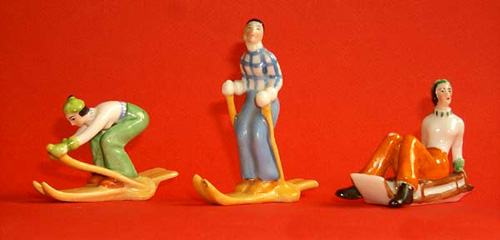 Figurines of females skiing and sledging